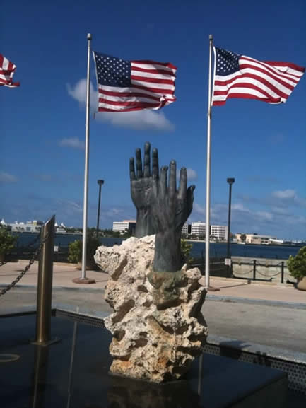 Hands with bent fingers in front of the conference hotel in Miami